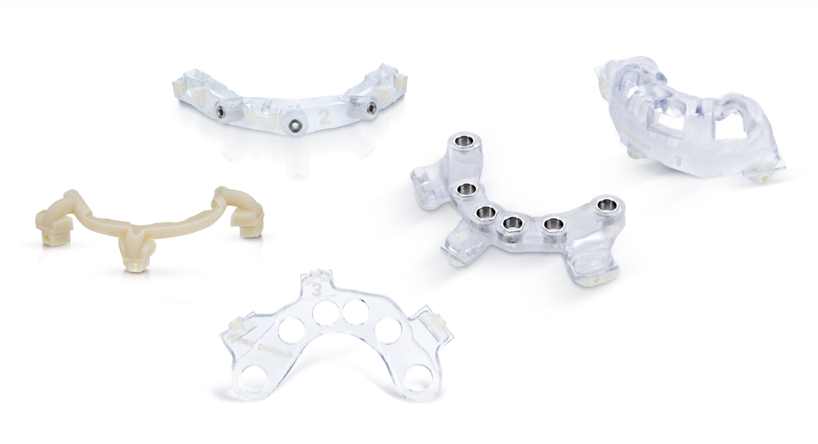 A set of transparent and opaque guided surgery templates designed to support accurate dental implant placement. These surgical guides are used with digital planning software to ensure precise positioning and predictable outcomes in implant procedures.