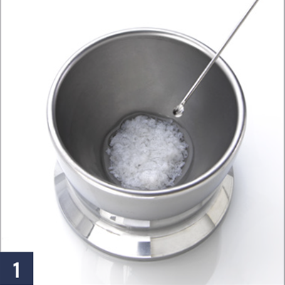 Hydrate the chosen bone graft material with saline and remove excess fluid with gauze.